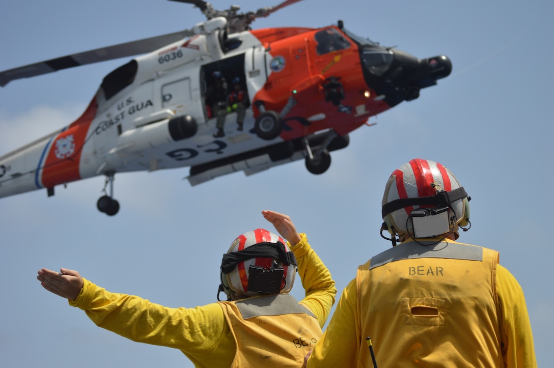 Coast Guard Cutter Bear (WMEC-901) conducts joint operations with a Coast Guard MH-60 Jayhawk helicopter aircrew, Aug. 20, 2024, while at sea north of Haiti. Bear’s crew conducted a 58-day homeland security and counter-drug patrol while operating in the Seventh Coast Guard District area of responsibility. (U.S. Coast Guard photo by Petty Officer 2nd Class Joshua Palmer)