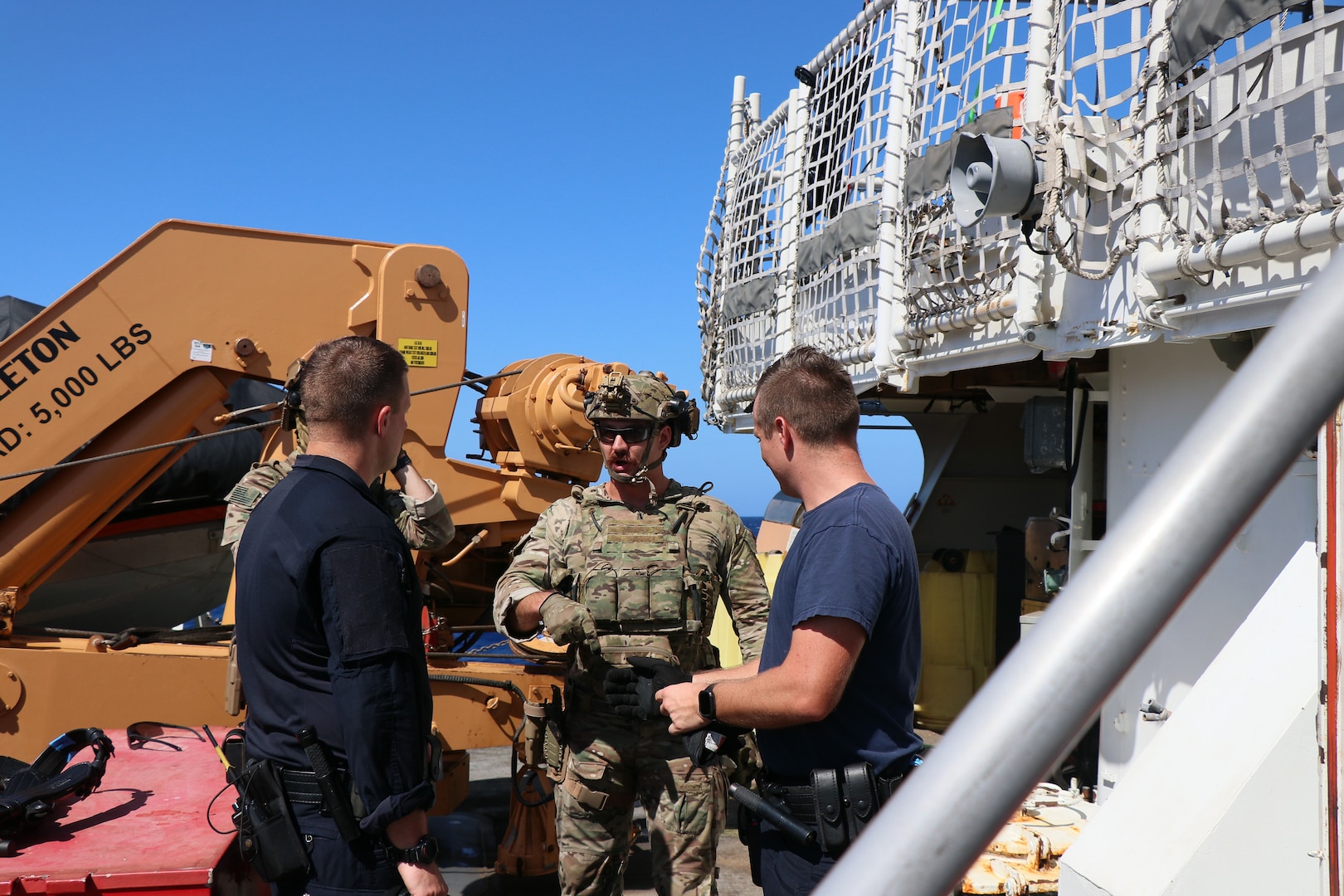 Coast Guard Tactical Law Enforcement Team Pacific Law Enforcement Detachment 111 crew members, embarked aboard Royal Navy offshore patrol vessel HMS Trent (P 224), coordinate a transfer with Coast Guard Cutter Bear (WMEC-901) crew members, Aug. 24, 2024, while aboard the cutter in the Windward Passage. Bear’s crew conducted a 58-day homeland security and counter-drug patrol while operating in the Seventh Coast Guard District area of responsibility. (U.S. Coast Guard photo by Petty Officer 1st Class Jeremy Wilbanks)