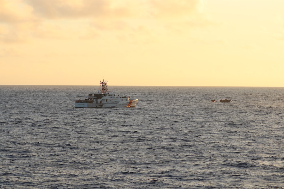 Coast Guard Cutter Kathleen Moore (WPC-1109) interdicts an overloaded vessel unlawfully bound for the United States by sea with over 100 migrants on board, Sept. 15, 2024, while conducting joint migrant interdiction operations with Coast Guard Cutter Bear (WMEC-901) north of Haiti. Operation Vigilant Sentry’s mission is to deter unlawful migration while also making sure that dangerously overloaded vessels are stopped to prevent loss of life at sea. (U.S. Coast Guard photo by Petty Officer 1st Class Jeremy Wilbanks)