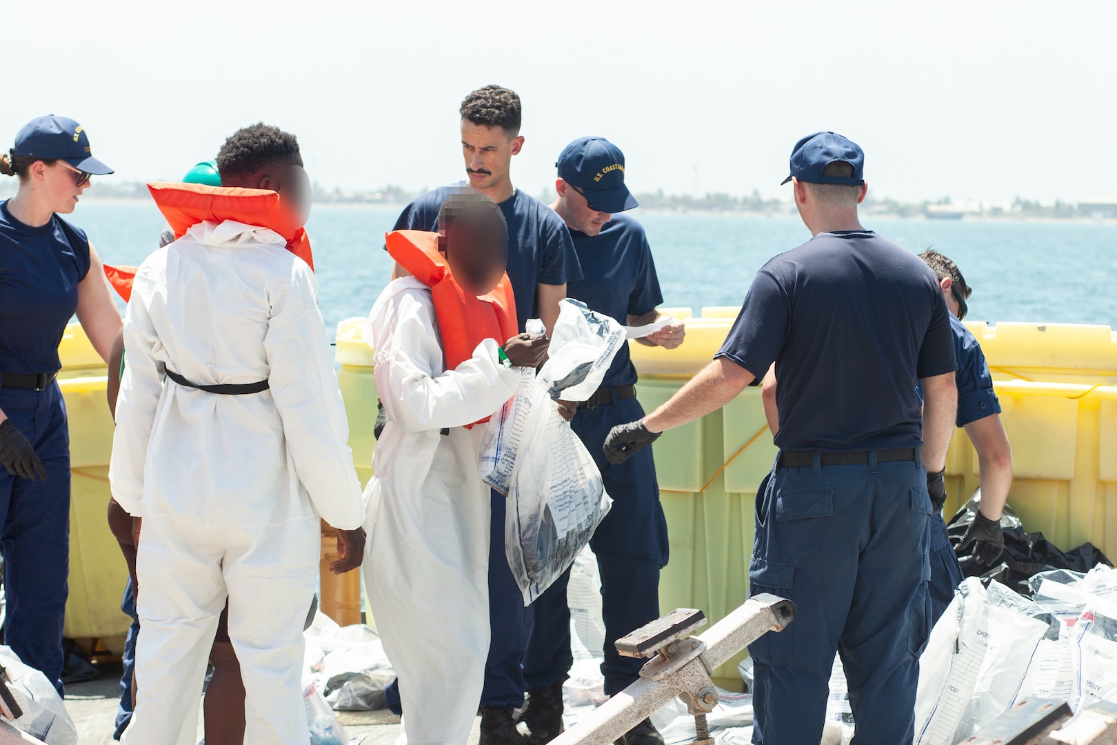 Coast Guard Cutter Bear (WMEC 901) crew members repatriate Haitian migrants while working with the Haitian Coast Guard, Sept. 18, 2024, in Cap-Haïtien, Haiti. Bear’s crew conducted a 58-day homeland security and counter-drug patrol while operating in the Seventh Coast Guard District area of responsibility. (U.S. Coast Guard photo by Petty Officer 1st Class Jeremy Wilbanks)