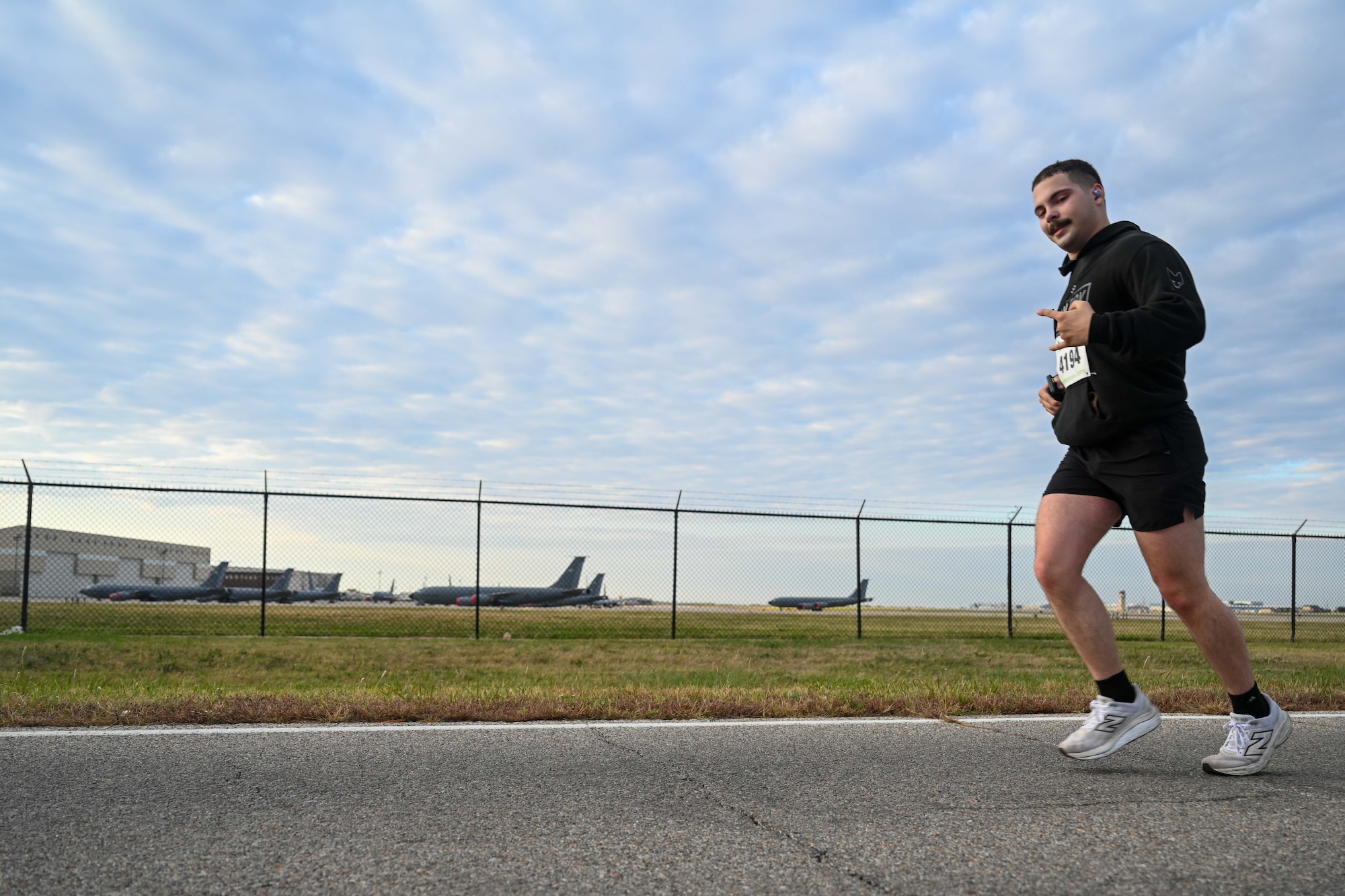 An Airman from the 22nd Air Refueling Wing runs in the Tanker Trot Oct. 19, 2024, at McConnell Air Force Base, Kansas. The Tanker Trot is an annual event featuring both a 5K and 10K bringing together Airmen, their families and the local community to promote fitness and camaraderie. (U.S. Air Force photo by Senior Airman William Lunn)