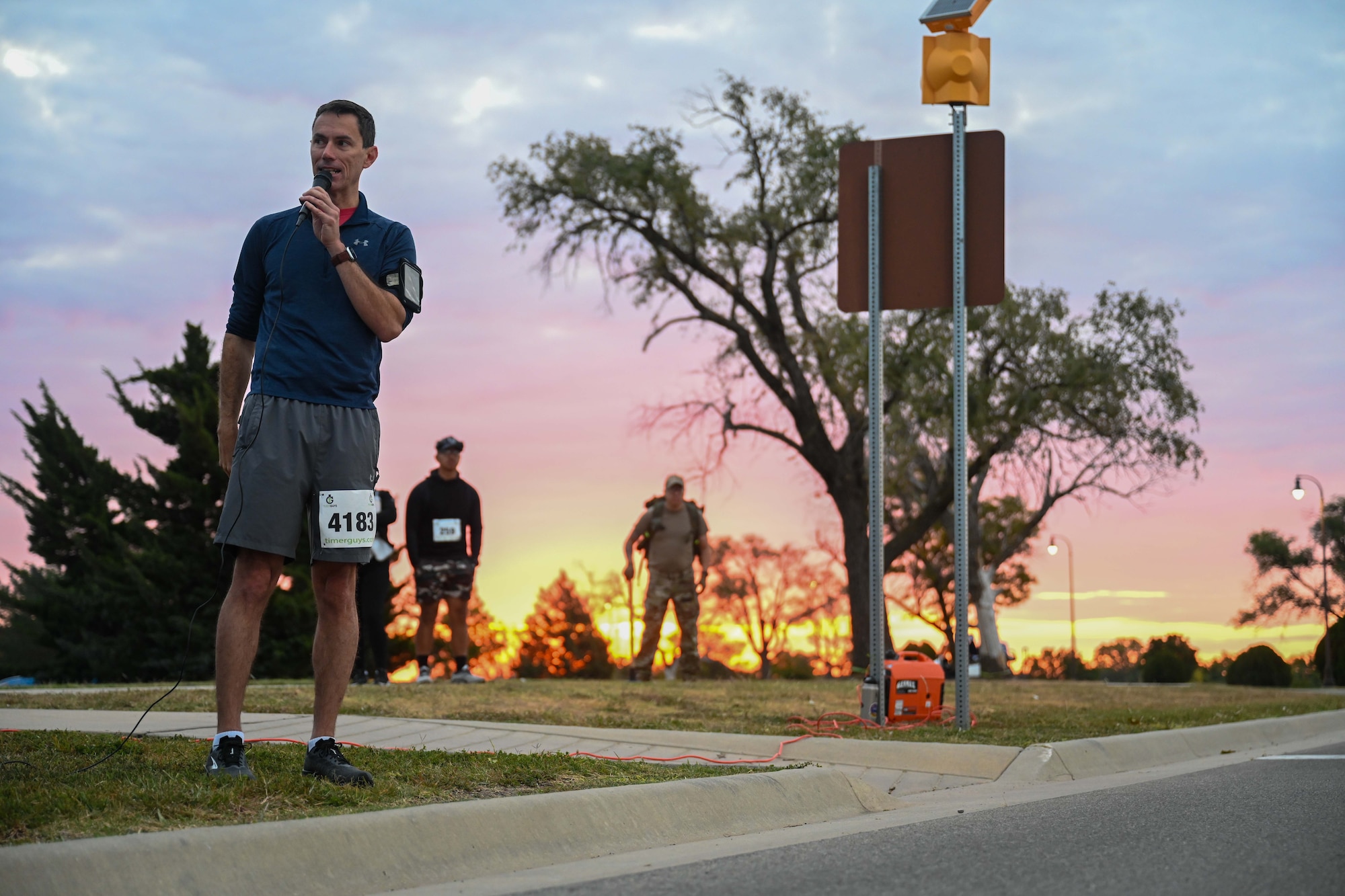 Col. Cory Damon, 22nd Air Refueling Wing commander, speaks during the Tanker Trot Oct. 19, 2024, at McConnell Air Force Base, Kansas. The Tanker Trot is an annual event featuring both a 5K and 10K bringing together Airmen, their families and the local community to promote fitness and camaraderie. (U.S. Air Force photo by Senior Airman William Lunn)