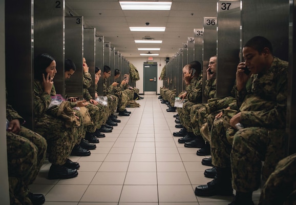 Recruits call home during scheduled divisional phone calls at Navy’s Recruit Training Command, Great Lakes, Illinois, December 9, 2023 (U.S. Navy/Stuart Posada)