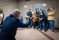 Dave Votroubek, training manager, Shop 71, Painters, Blasters and Tilesetters, takes photos of some of his students before the 2024 Puget Sound Naval Shipyard & Intermediate Maintenance Facility Apprentice Program graduation ceremony, Sept. 20, 2024, at Bremerton High School, in Bremerton, Washington. (U.S. Navy photo by Wendy Hallmark)