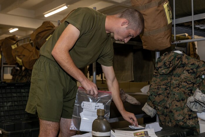 U.S. Marine Corps Recruit Jacob Browne with Kilo Company, 3rd Recruit Training Battalion, organizes his belongings during senior drill instructor square away time at Marine Corps Recruit Depot San Diego, California, Oct. 8, 2024. SDI time is periodically scheduled to enable senior drill instructors to have the opportunity to address instructional remediation, core values reinforcement, mentorship, coaching and future training preparation. (U.S. Marine Corps photo by Lance Cpl. Janell B. Alvarez)