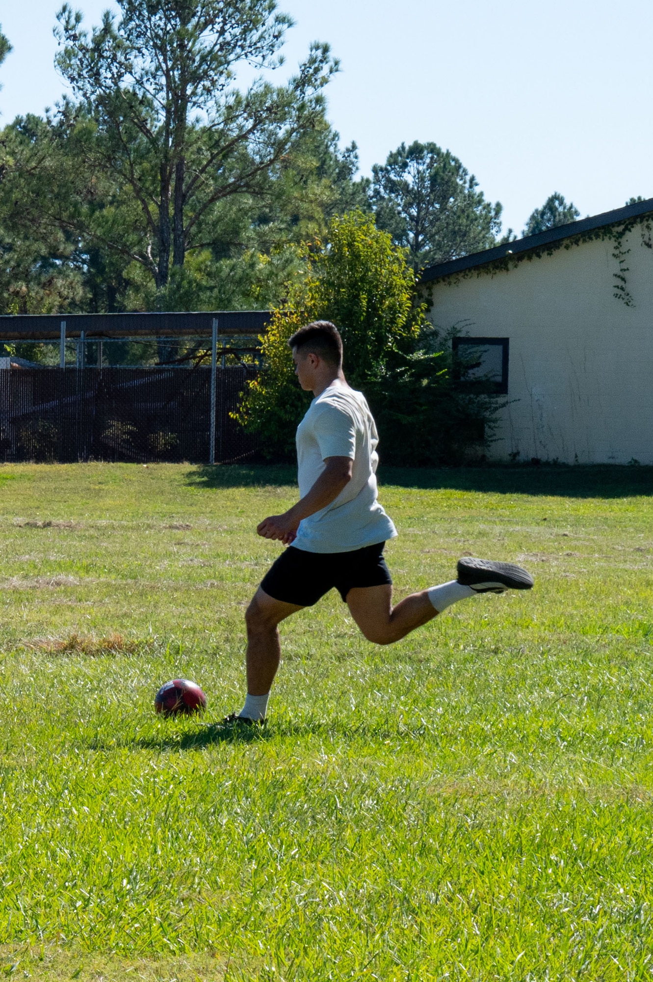 A U.S. Airman kicks a corner kick during a 42nd Air Base Wing Sports Day at Maxwell Air Force Base, Alabama, Oct 18. 2024. The event gave units a chance to compete against each other and build comradery.