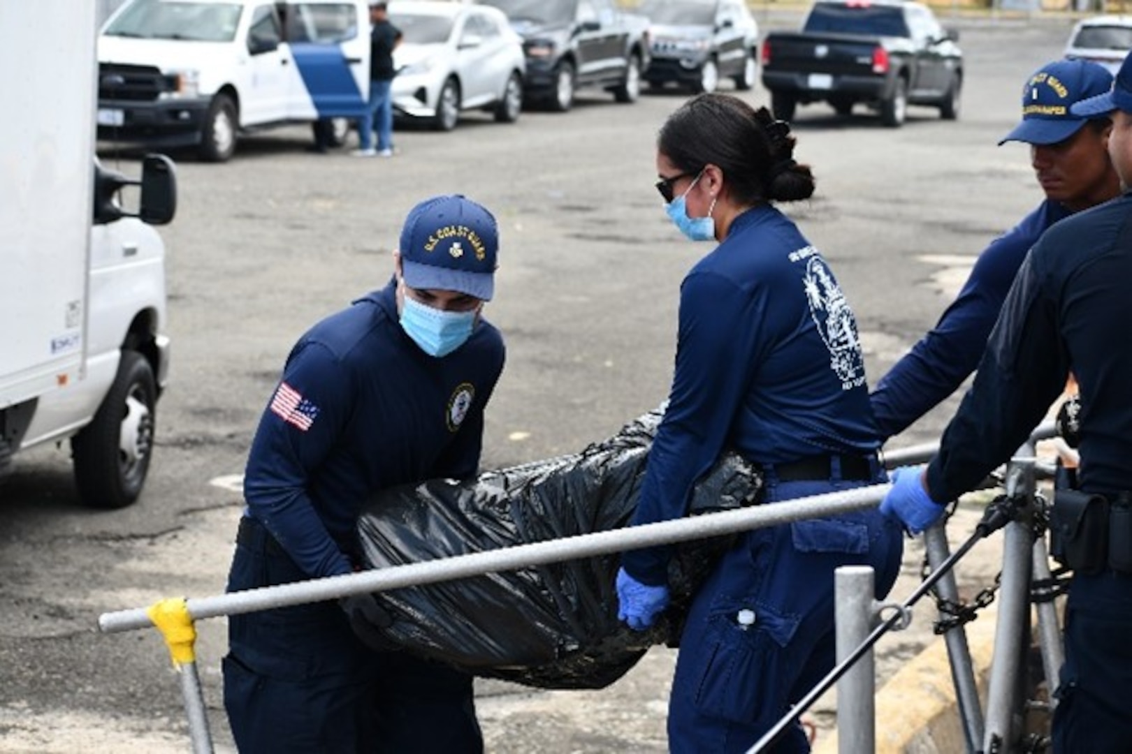 Coast Guard Cutter Joseph Napier crewmembers offload 664 pounds (301 kgs) of seized cocaine and transfer custody of six smugglers to Coast Guard Investigative Service and FBI Special Agents in Mayaguez, Puerto Rico, Oct. 19, 2024. The seized contraband was interdicted at-sea north of Puerto Rico, Oct. 13, 2024, and was estimated to have a wholesale value of approximately $3.5 million. (U.S. Coast Guard photo)