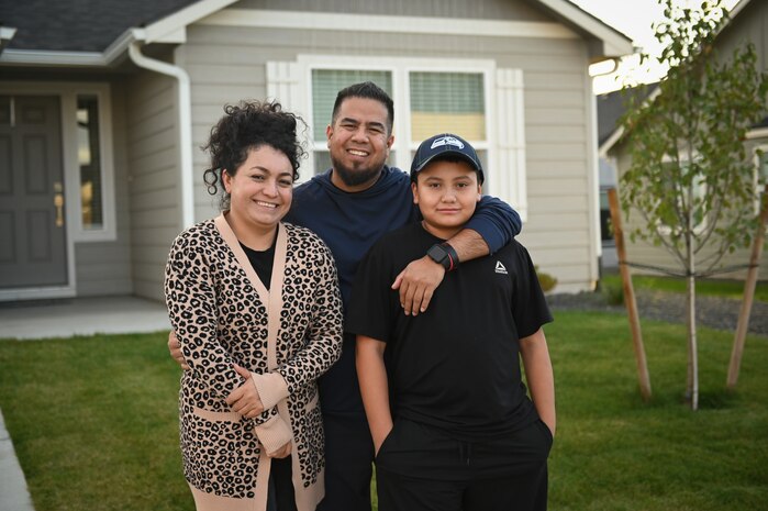 Juan Gaytan stands with his family outside their home in Walla Walla, Washington, on Oct. 17, 2024. His wife Roxana and his son Ian were very supportive of his aspirations to become an electrical engineer.