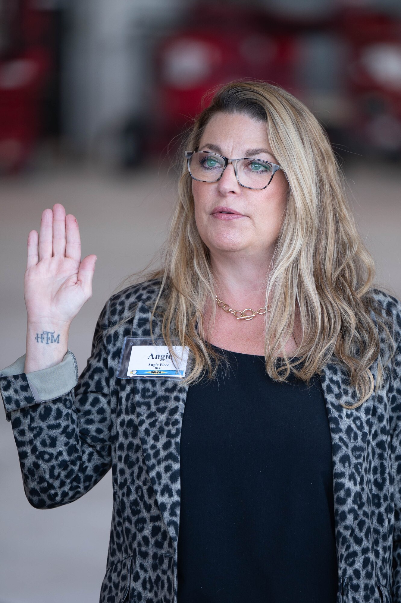 Angie Ficco, Acadia Healthcare community outreach director, recites the Honorary Commander oath during the 2025 HCC Induction Ceremony at Dover Air Force Base, Delaware, Oct. 22, 2024. Established in 1992, the HCC program is a community outreach effort that builds upon the strong relationships between local civic leaders and Dover AFB personnel. (U.S. Air Force photo by Mauricio Campino)