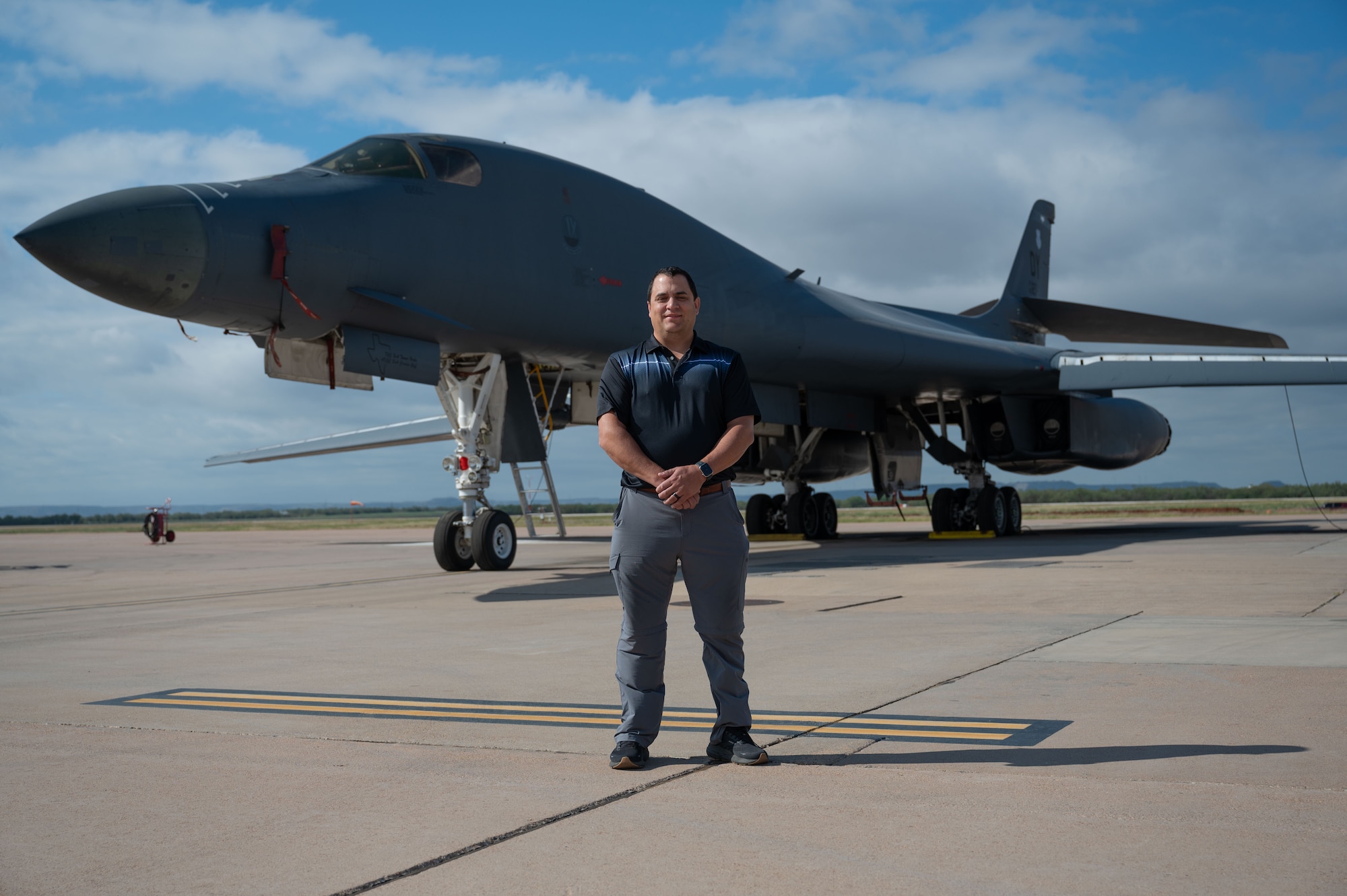 Joey Acklin, son of Maj. James Acklin, 338th Combat Crew Training Squadron pilot, poses for a photo in front of a B-1B Lancer at Dyess Air Force Base, Texas, Oct. 21, 2024. During his visit, Joey toured a B-1B and met with aircrew members to learn about today’s aircraft capabilities. (U.S. Air Force photo by Airman 1st Class Emma Anderson)