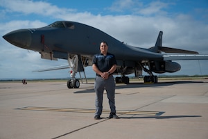 Joey Acklin, son of Maj. James Acklin, 338th Combat Crew Training Squadron pilot, poses for a photo in front of a B-1B Lancer at Dyess Air Force Base, Texas, Oct. 21, 2024. During his visit, Joey toured a B-1B and met with aircrew members to learn about today’s aircraft capabilities. (U.S. Air Force photo by Airman 1st Class Emma Anderson)