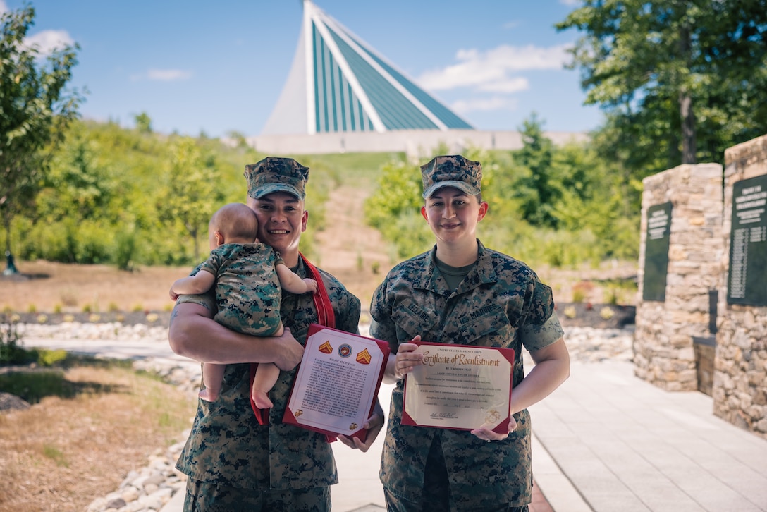 U.S. Marine Corps Cpl. Sean LeClaire, an Oregon native and combat videographer, left, and his wife Lance Cpl. Kayla LeClaire, an Alabama native and combat photographer, both with Communications Strategy and Operations, pose for a photo after a ceremony at the National Museum of the Marine Corps, Triangle, Virginia, July 11, 2024. The LeClaire family celebrated Sean’s promotion to corporal and Kayla’s reenlistment in front of their friends and the COMMSTRAT family. (U.S. Marine Corps photo by Lance Cpl. Joaquin Dela Torre)