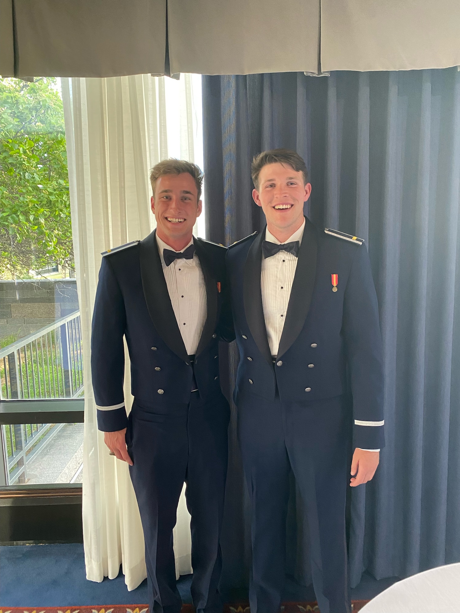 Jakob Stone, Midwestern State University soccer player and U.S. Air Force Academy graduate, poses for a photo with a classmate at his 2024 officer commissioning ceremony