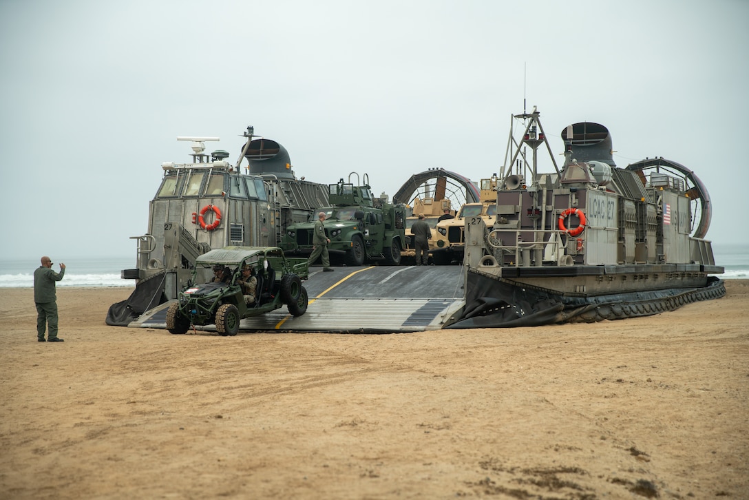 U.S. Marines assigned to Alpha Company, Battalion Landing Team 1/5, 15th Marine Expeditionary Unit, drive an Ultra Light Tactical Vehicle off U.S. Navy Landing Craft, Air Cushion 27, attached to Assault Craft Unit 5, aboard Marine Corps Base Camp Pendleton, California Oct. 16, 2024. Elements of the 15th MEU embarked aboard amphibious dock landing ship USS Harpers Ferry (LSD 49), returned to Marine Corps Base Camp Pendleton after a seven-month deployment to the Indo-Pacific region in support of regional stability and a free and open Indo-Pacific. (U.S. Marine Corps photo by Sgt. Patrick Katz)