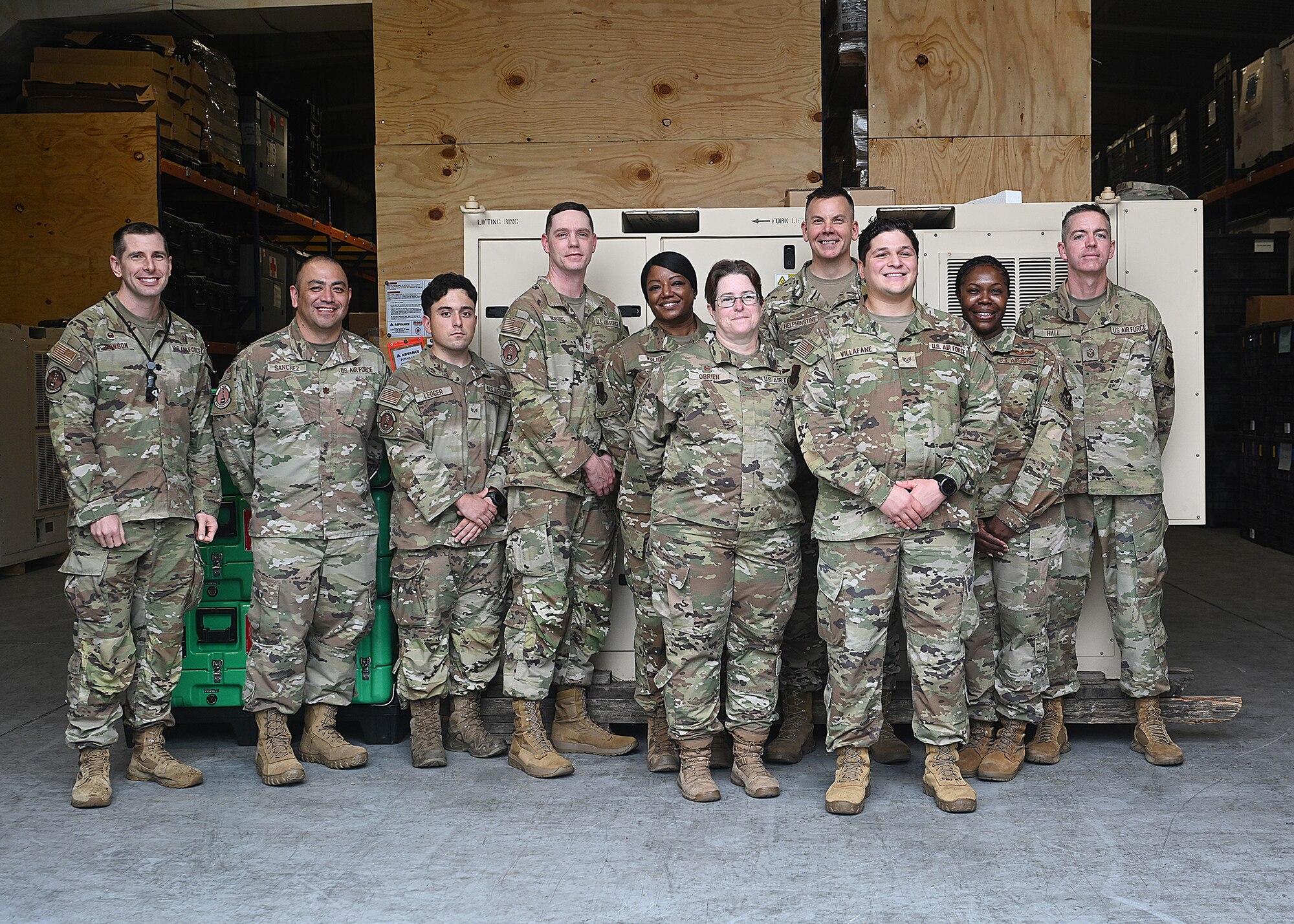 U.S. Air Force Brig. Gen. Kurt Helphinstine, 7th Air Force deputy commander, takes a photo with Airmen assigned to the 8th Healthcare Operations Squadron.