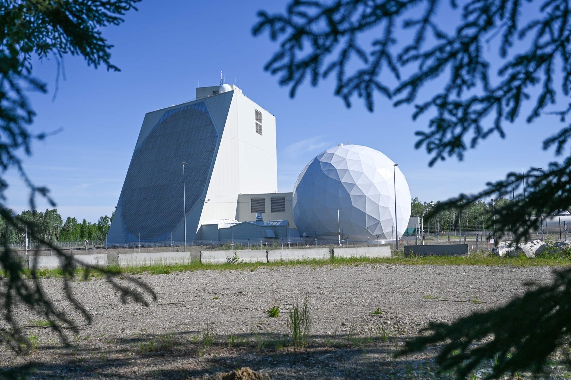 The long-range ballistic missile surveillance radar building, part of the Solid State Phased Array Radar Systems at the 213th Space Warning Squadron, Clear Space Force Station, Alaska, on June 21, 2024. SSPARS includes radar, computer and communications systems for ballistic missile warning and space surveillance.