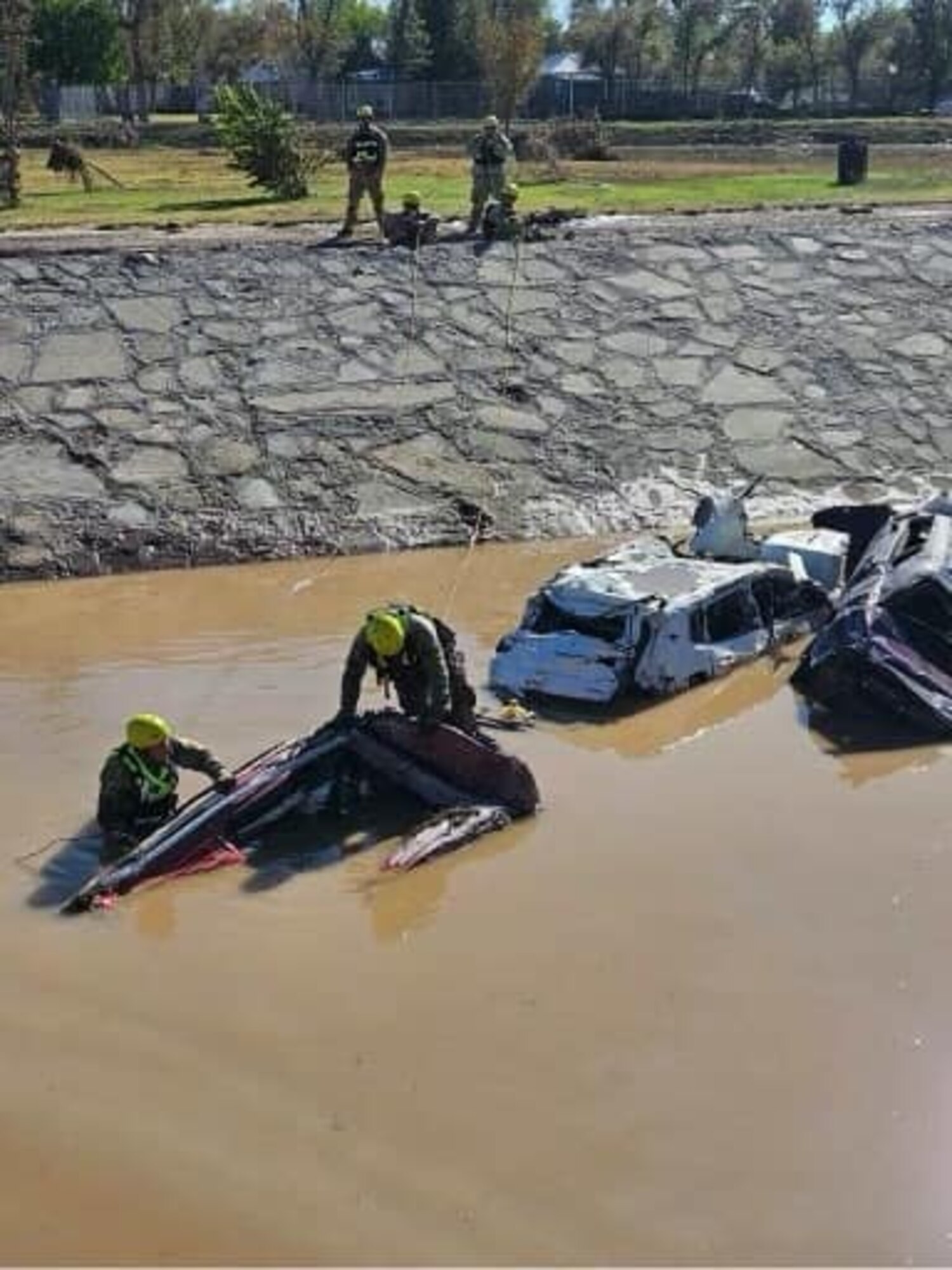 New Mexico National Guard members check submerged vehicles around Roswell, New Mexico, Oct. 20, 2024, after extreme flooding in the area.