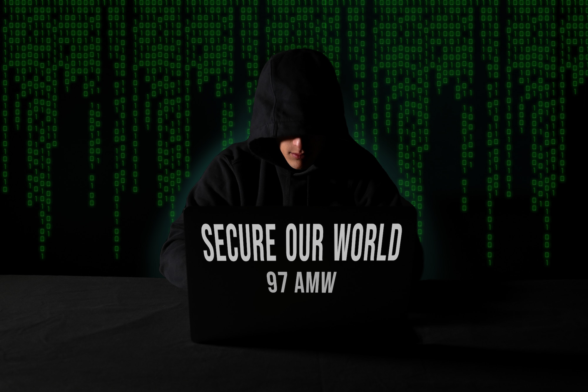 U.S. Air Force photo illustration features a man sitting in front of a laptop, surrounded by computer code, and was created in honor of Cybersecurity Awareness Month at Altus Air Force Base, Oklahoma, Oct. 22, 2024. Cybersecurity Awareness Month is an initiative designed to educate the public about online safety and empower individuals and businesses to safeguard their data against cybercrime. (U.S. Air Force photo illustration by Airman 1st Class Lauren Torres)