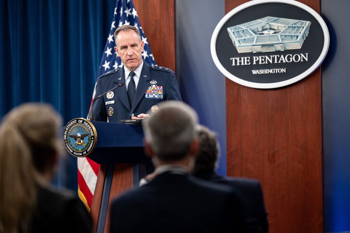 A man speaks to an audience from a podium.