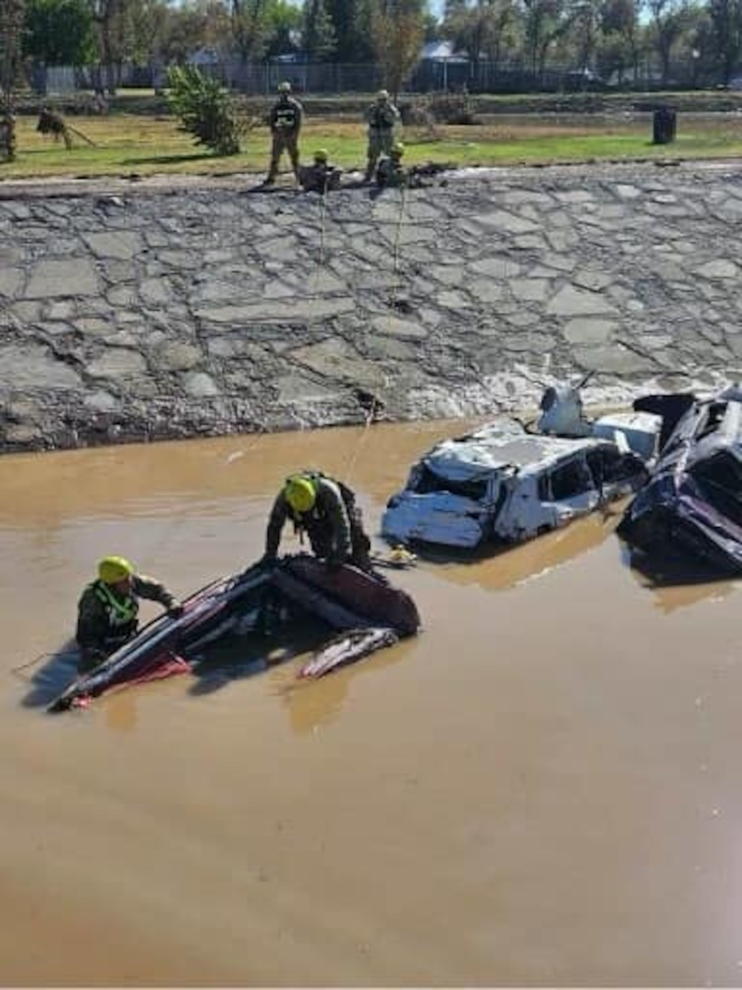 New Mexico National Guard members check submerged vehicles around Roswell, New Mexico, Oct. 20, 2024, after extreme flooding in the area.