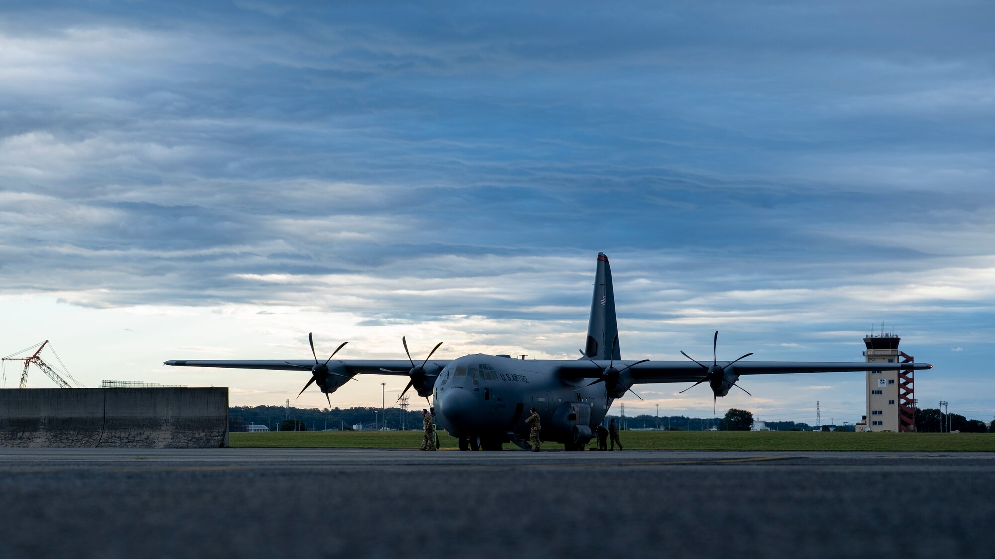 A C-130J Super Hercules is parked on the Yokota Air Base flightline.