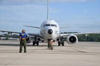 241001-N-HM576-1023 NAS JACKSONVILLE, Fl. (Oct. 01, 2024) Aviation Machinist’s Mate Airman Andrew Taylor and Aircrew Survival Equipmentman Airman Michael Thompson Jr. launch a P-8A Poseidon as it leaves for deployment, Oct. 1. The Patrol Squadron (VP) 26 “Tridents” are based in Jacksonville, Florida, and are currently forward deployed to Naval Air Station Sigonella, Sicily. The squadron conducts maritime patrol and reconnaissance, as well as theater outreach operations, as part of a rotational deployment to the U.S. 6th Fleet area of operations. (U.S. Navy photo by Mass Communication Specialist 2nd Class Aubrey Stueven)