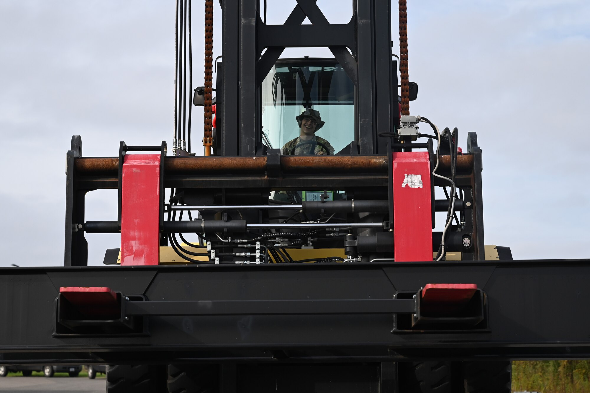 airman drives a forklift