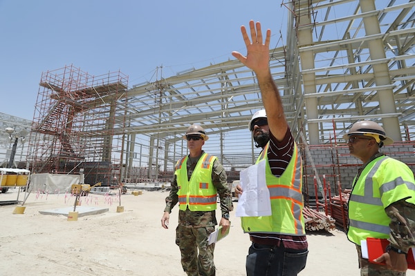 Three U.S. Army Corps of Engineers standing on a project site in the U.S. Central Command area of responsibility.