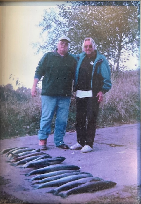 Dillard Dowell, left, grandfather of U.S. Air Force Staff Sgt. Cody Dowell, 97th Air Mobility Wing Public Affairs Office noncommissioned officer in charge, and Russ Carter, right, Dillard Dowell’s best friend and fishing partner, stand by all the fish they caught that day, roughly early 2000’s, on a river in Washington State.  (complementary photo from Staff Sgt. Cody Dowell)