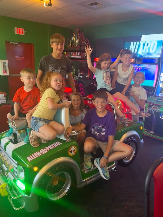 The great-grandchildren of Dillard Dowell, grandfather of U.S. Air Force Staff Sgt. Cody Dowell, 97th Air Mobility Wing Public Affairs Office noncommissioned officer in charge, group together for a photo, July 19, 2024, at a pizza parlor in Washington State. (complementary photo from Staff Sgt. Cody Dowell)