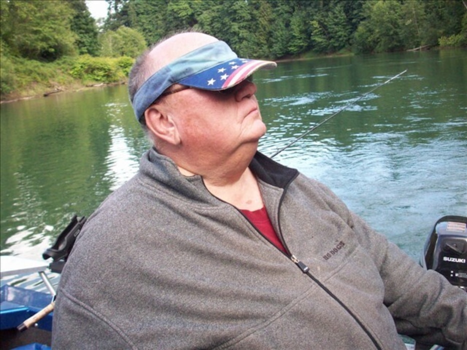 Dillard Dowell, grandfather of U.S. Air Force Staff Sgt. Cody Dowell, 97th Air Mobility Wing Public Affairs Office noncommissioned officer in charge, sits in a fishing boat, Feb. 25, 2008, on a river in Washington State.  (complementary photo from Staff Sgt. Cody Dowell)