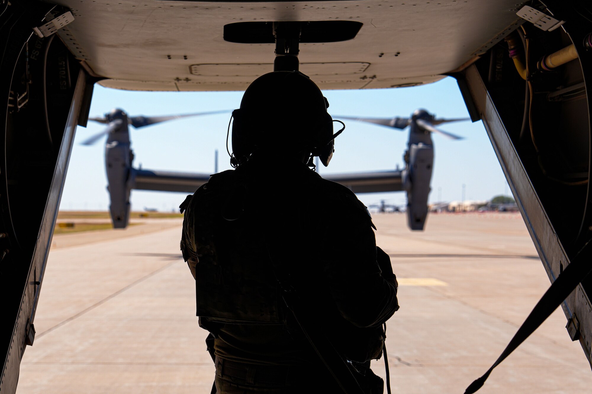 A U.S. Air Force Airman assigned to the 20th Special Operations Squadron prepares for take off on a CV-22 Osprey at Cannon Air Force Base, New Mexico, Oct. 9, 2024. Air Force Special Operations Command uses the CV-22 Osprey for long-range infiltration, exfiltration and resupply across the spectrum of competition and conflict. (U.S. Air Force photo by Airman 1st Class Gracelyn Hess)