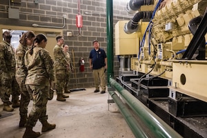 Members of the 316th CES inspect a generator during a facility exchange at Nationals Park.