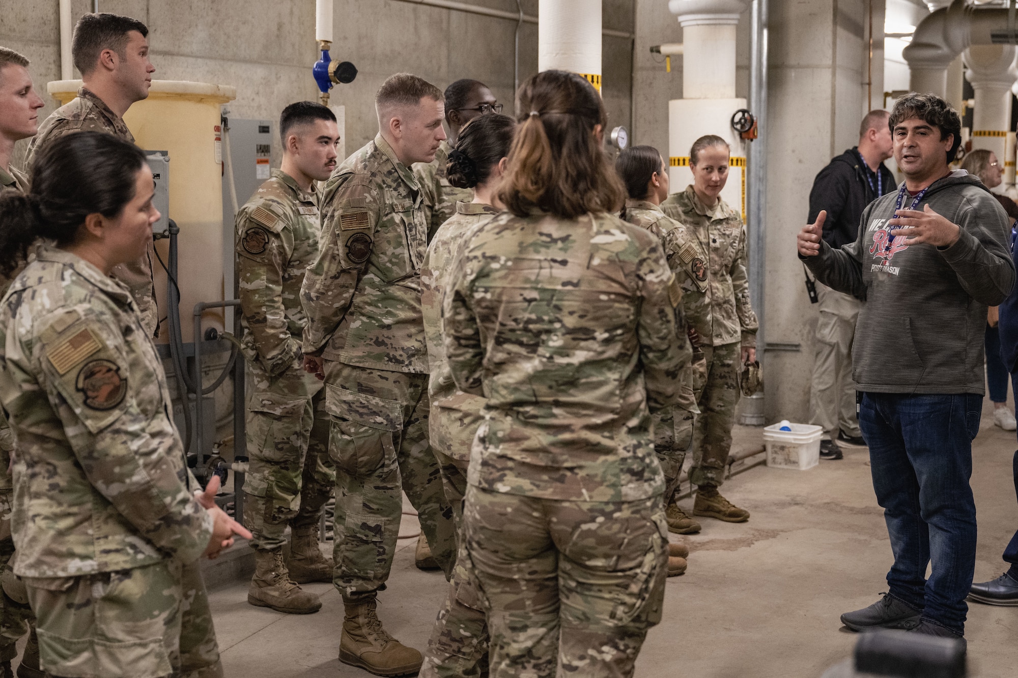 Airmen listen to a briefing during a facility exchange tour at Nationals Park.