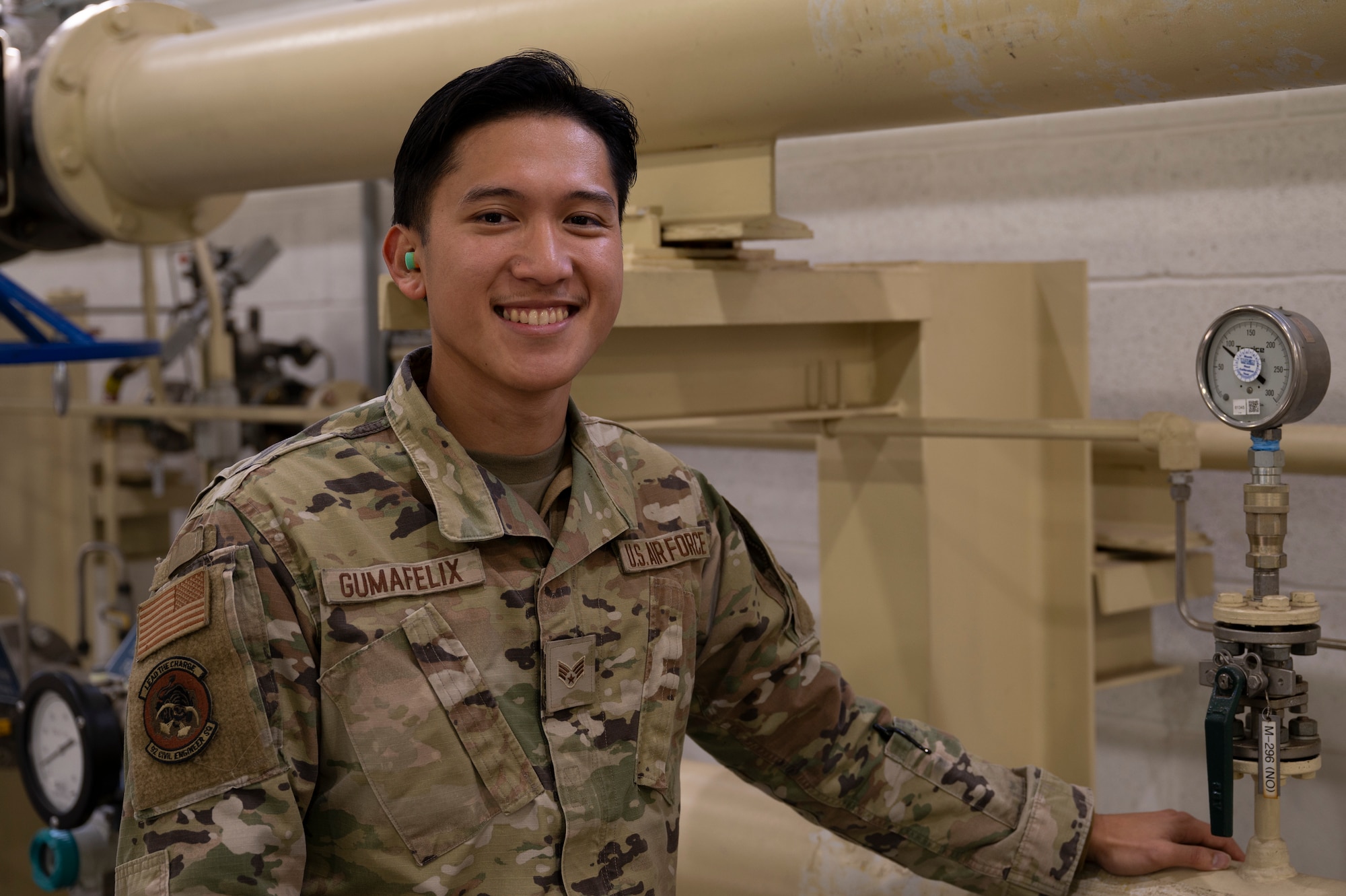 U.S. Air Force Senior Airman Aaron Vincent Gumafelix, a fuels systems maintenance specialist assigned to the 92nd Civil Engineering Squadron, poses for a photo at Fairchild Air Force Base, Washington, Oct. 1, 2024. Gumafelix deployed to Qatar from October 2023 to April 2024. The youngest of three children, Gumafelix is first-generation military, whose passion led him to join at the age of 22. (U.S. Air Force photo by Airman 1st Class Samantha Thorn)