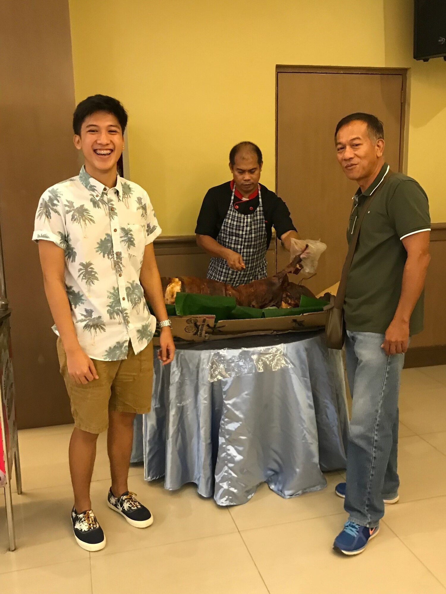 A man poses for a photo with his father