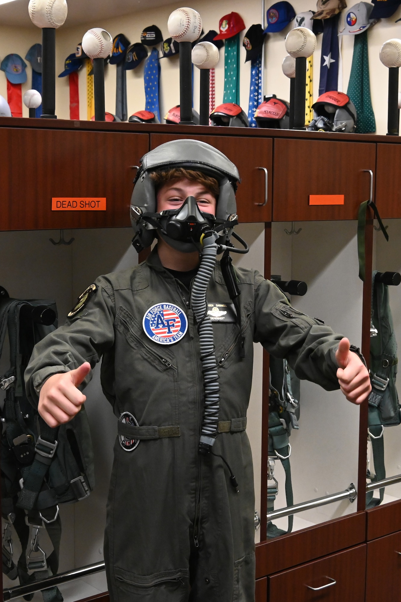 Carsen “Deadshot” Darnell, an 11-year-old local middle schooler who is currently battling spinal cancer, donned a flight suit and helmet before posing for a picture at Kingsley Field in Klamath Falls, Oregon.