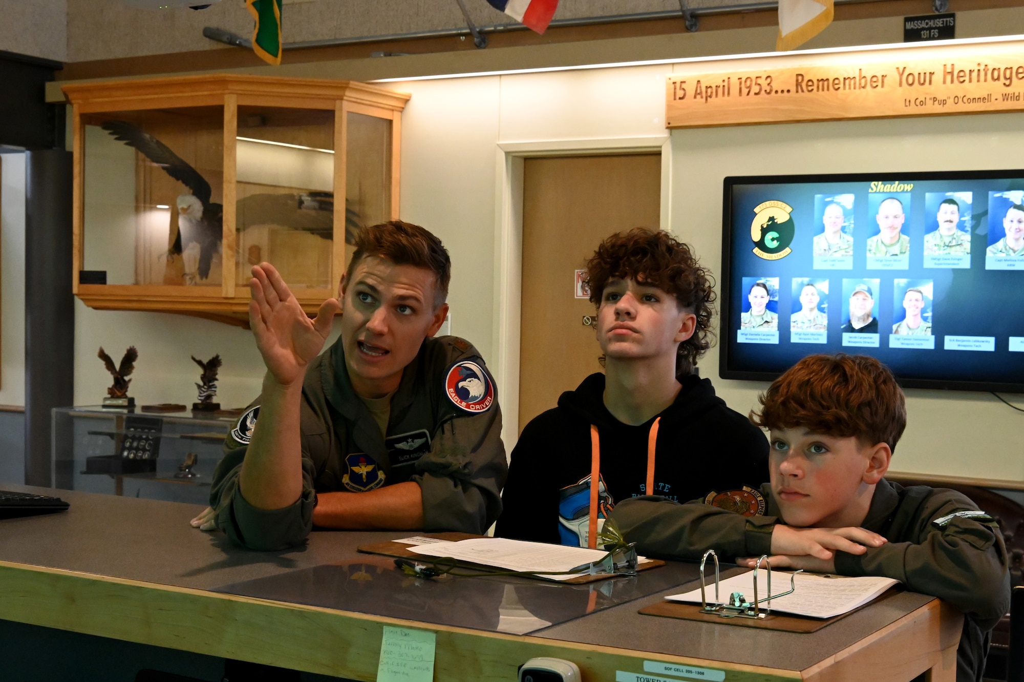 U.S. Air Force Maj. Edwin Kingman, 114th Fighter Squadron F-15C instructor pilot, provides a preflight mission briefing for Carsen "Deadshot" Darnell.