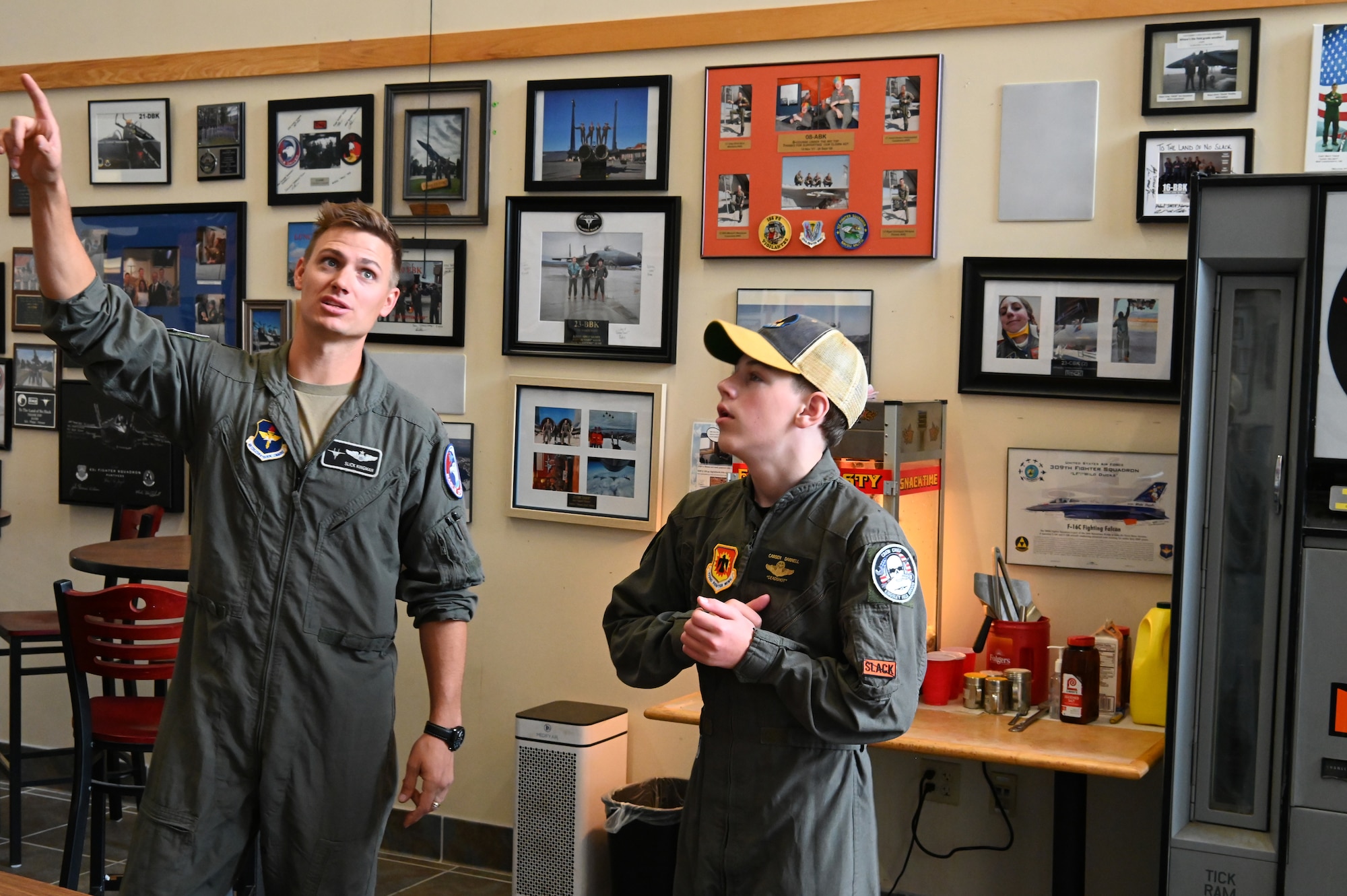 U.S. Air Force Maj. Edwin Kingman, 114th Fighter Squadron F-15C instructor pilot, gives Carsen Darnell a tour of the 173rd Fighter Wing operations building at Kingsley Field in Klamath Falls, Oregon.