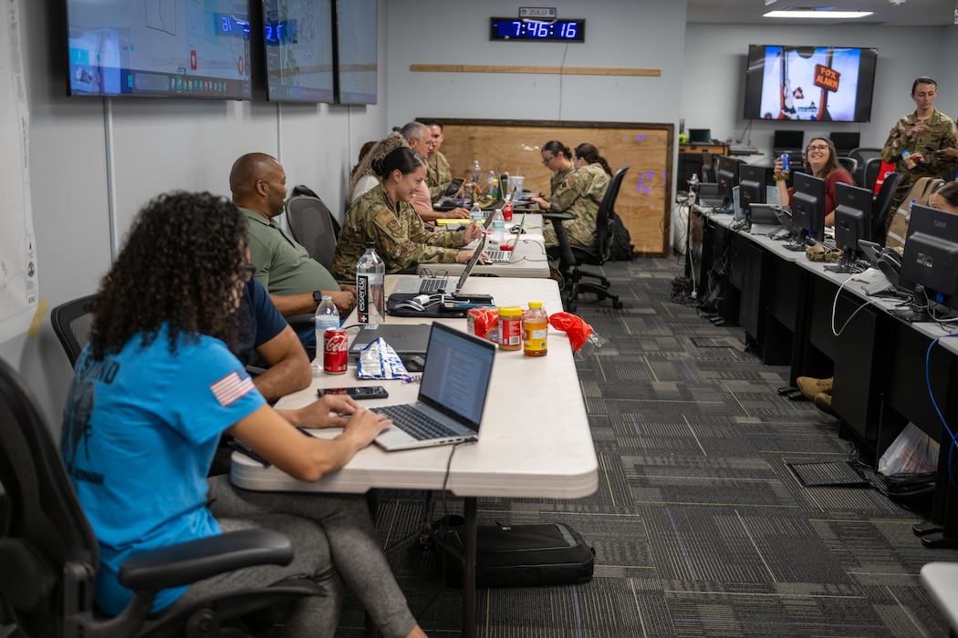 Airmen work on their computers for the eoy closeout