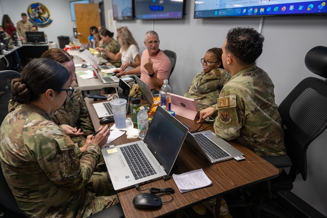 Airmen work on their computers for the eoy closeout