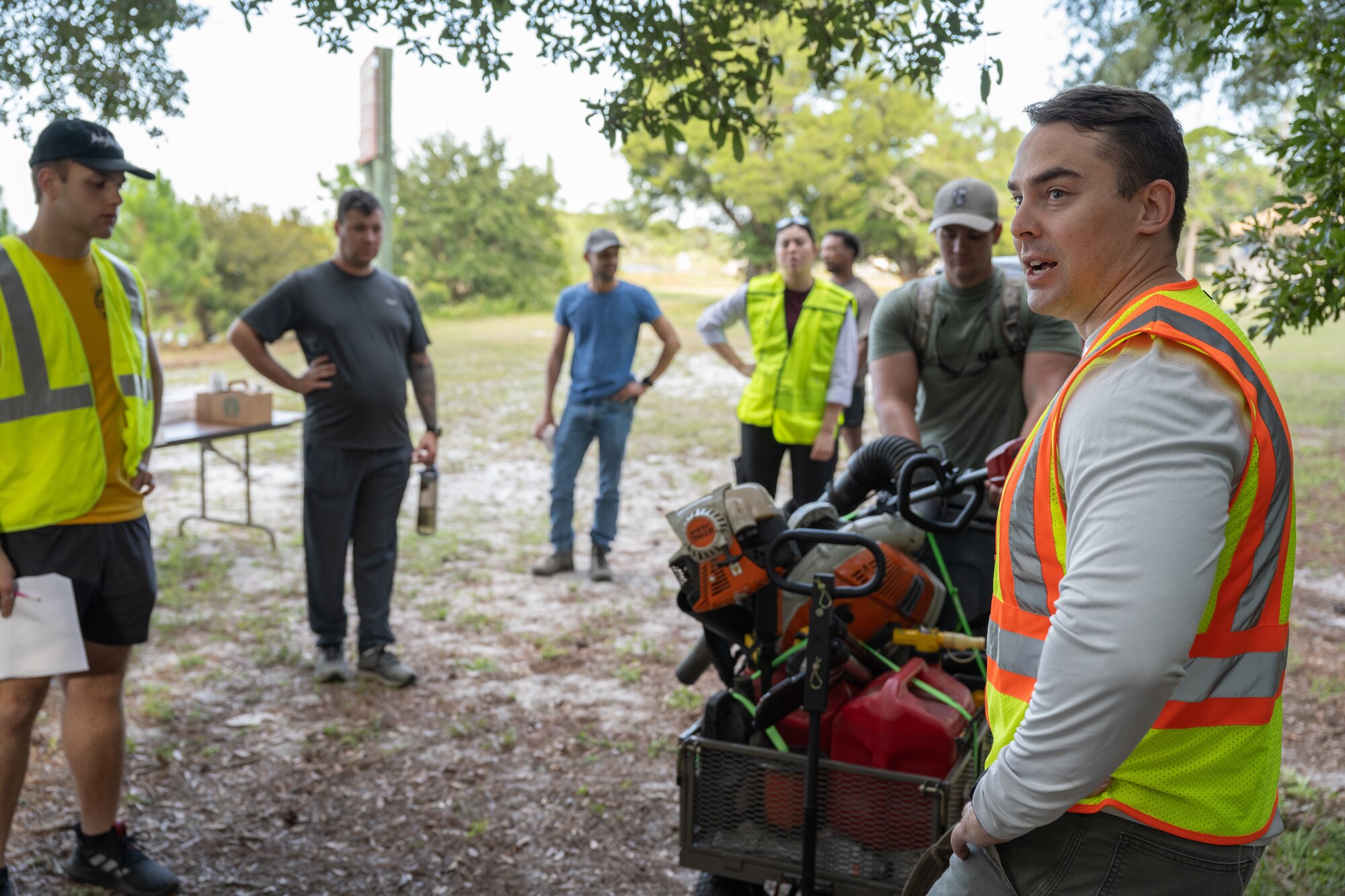 A group of volunteers discuss restoration of Grace Brown Nature Trail at Hurlburt Field, Florida, Oct. 3, 2024.