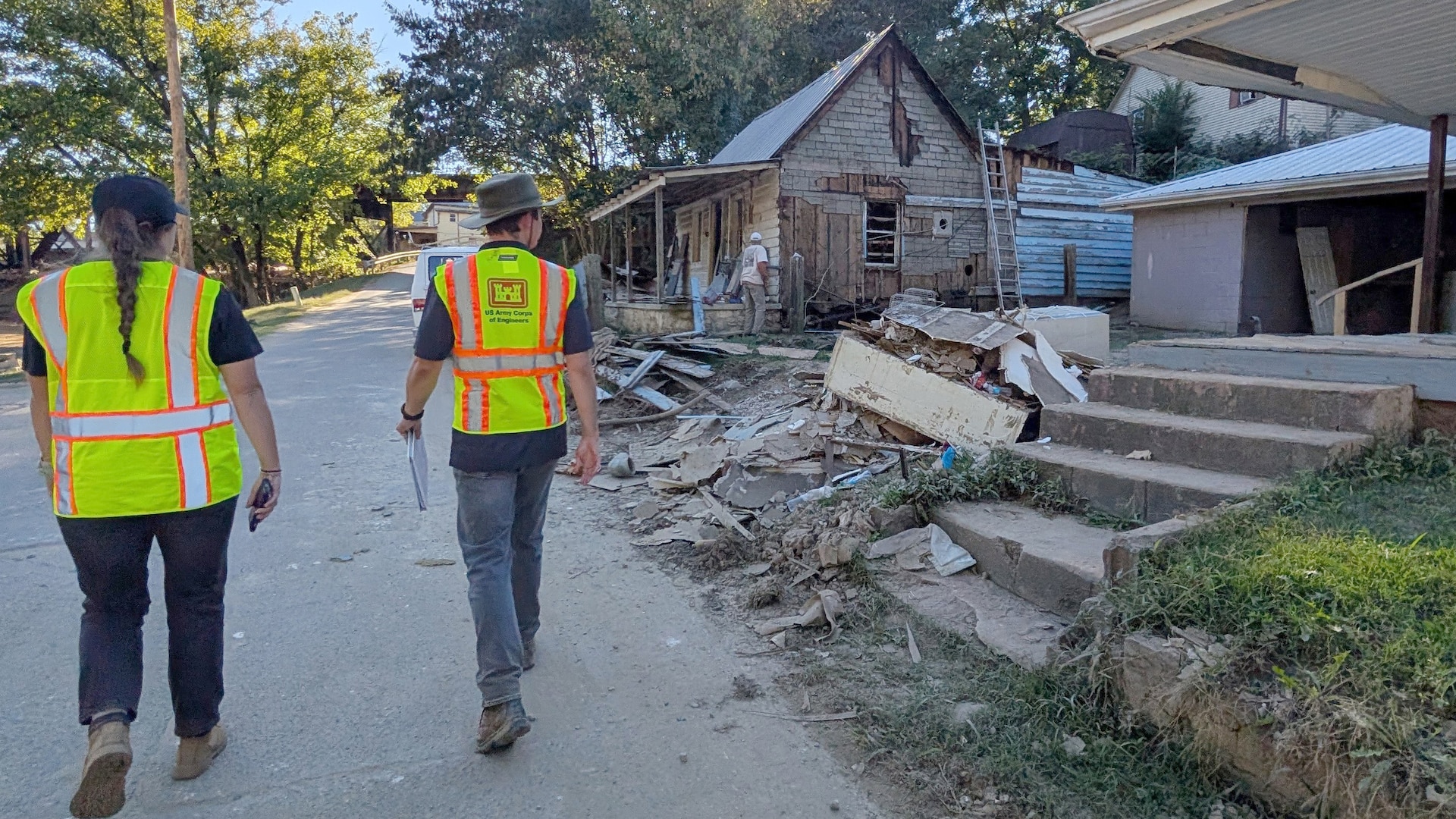 Cara Brown (Left) and Mark Veasey survey Hurricane Helene flood impacts Oct. 11, 2024, in Newport, Tennessee. By collecting accurate measurements of flood levels and their impact, the Corps of Engineers is building a foundation for more effective planning and response to future weather events.  (USACE Photo by Michael Krneta)