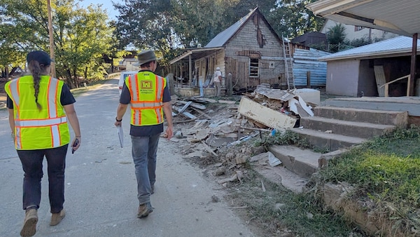 Cara Brown (Left) and Mark Veasey survey Hurricane Helene flood impacts Oct. 11, 2024, in Newport, Tennessee. By collecting accurate measurements of flood levels and their impact, the Corps of Engineers is building a foundation for more effective planning and response to future weather events.  (USACE Photo by Michael Krneta)