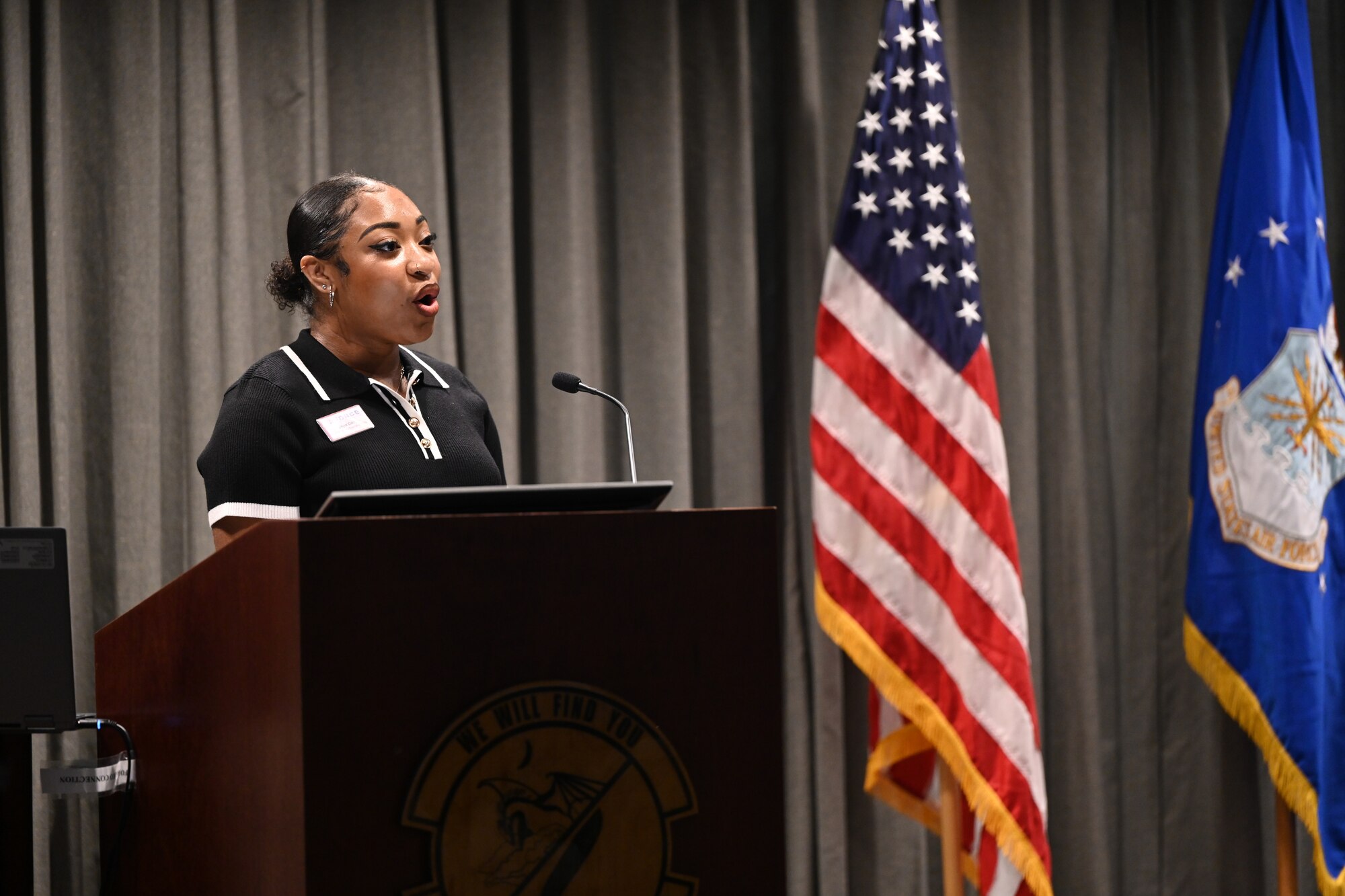Ms. Jayla Carr, 1st Special Operations Force Support Squadron Youth Program Intern, sings the National Anthem during a Distinguished Flying Cross Ceremony at Hurlburt Field, Florida, Oct. 8, 2024.