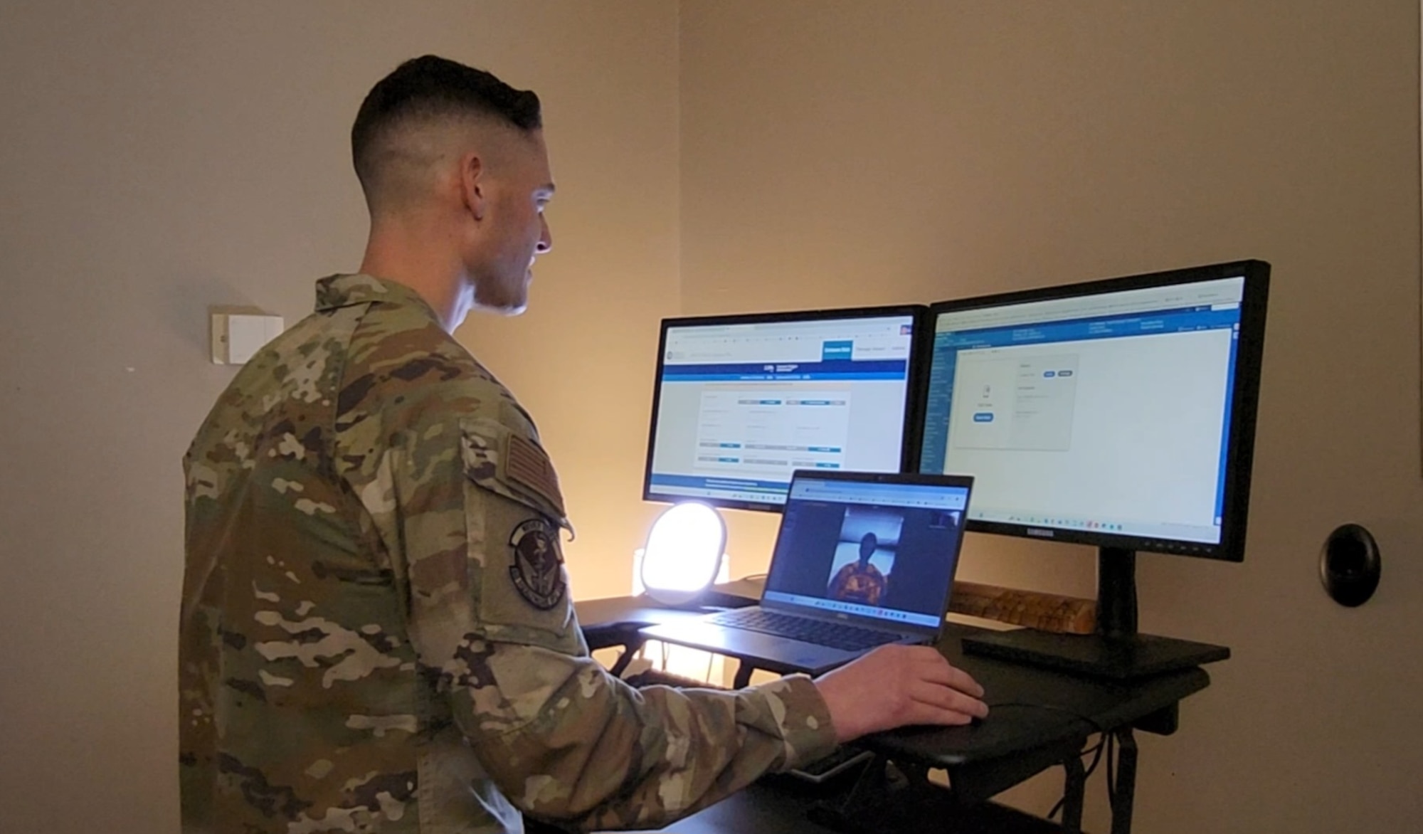 Capt. Vincent Doll, Physician Assistant in the Warrior Operational Medicine Clinic, conducts a virtual wellness visit at the Wright-Patterson Medical Center, Wright-Patterson Air Force Base, Ohio, (Courtesy Photo)