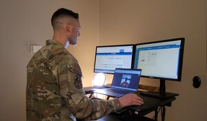 Capt. Vincent Doll, Physician Assistant in the Warrior Operational Medicine Clinic, conducts a virtual wellness visit at the Wright-Patterson Medical Center, Wright-Patterson Air Force Base, Ohio, (Courtesy Photo)