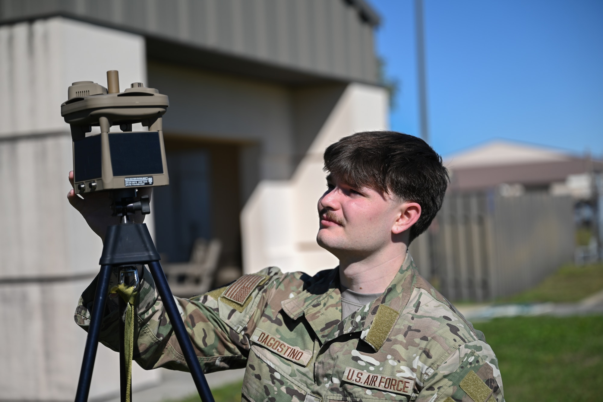 U.S Air Force Senior Airman Brock Dagostino, 1st Special Operations Support Squadron weather forecaster, sets up a micro weather sensor at Hurlburt Field, Florida, Oct. 17, 2024.