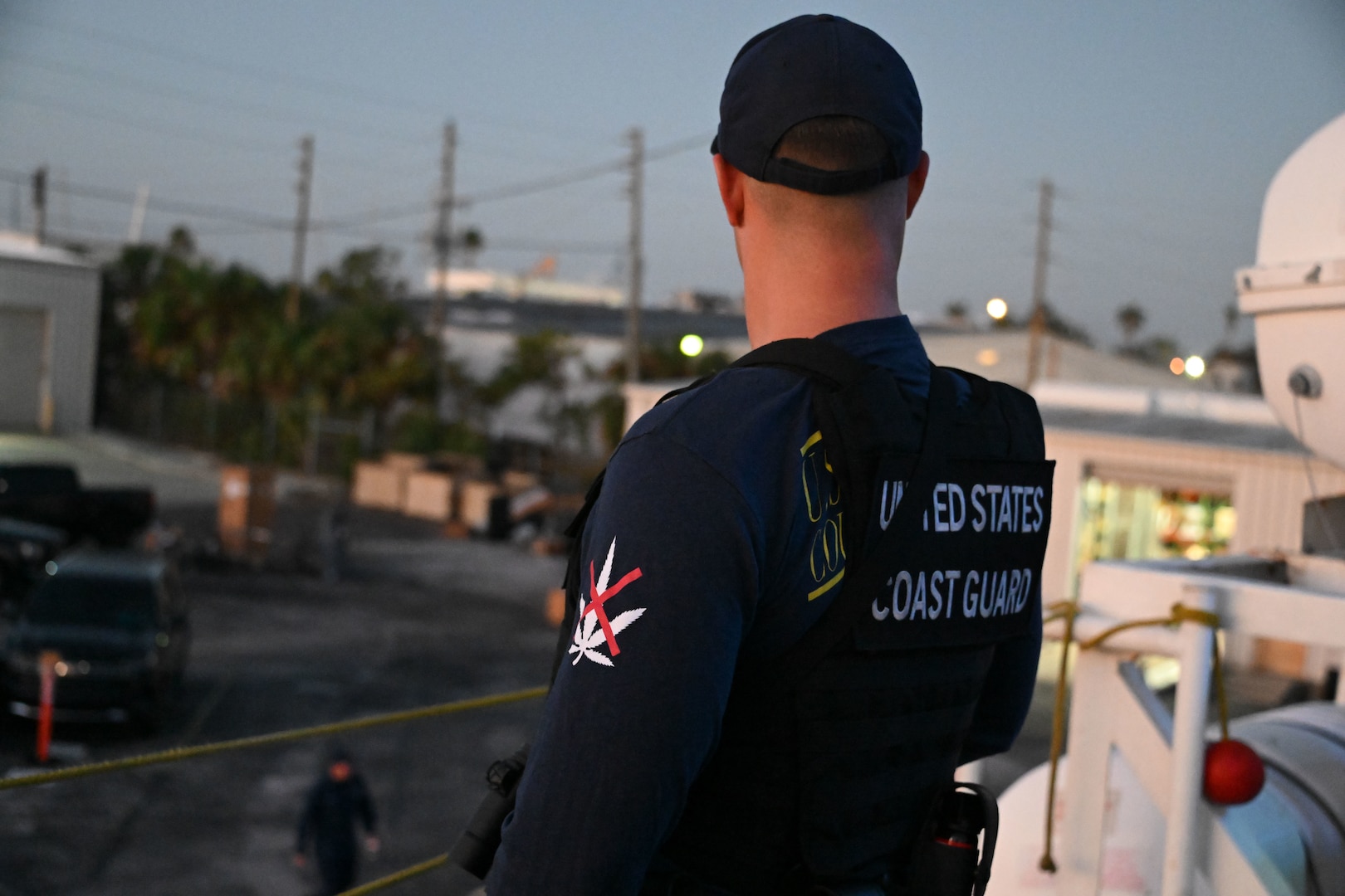 The crew of Coast Guard Cutter Resolute unload interdicted narcotics onto Sector St. Petersburg South Moorings, Florida, Oct. 23, 2024. Armed Coast Guardsmen stood watch over the interdicted drugs to ensure security and accountability of the seized contraband. (U.S. Coast Guard photo by Petty Officer 1st Class Riley Perkofski)