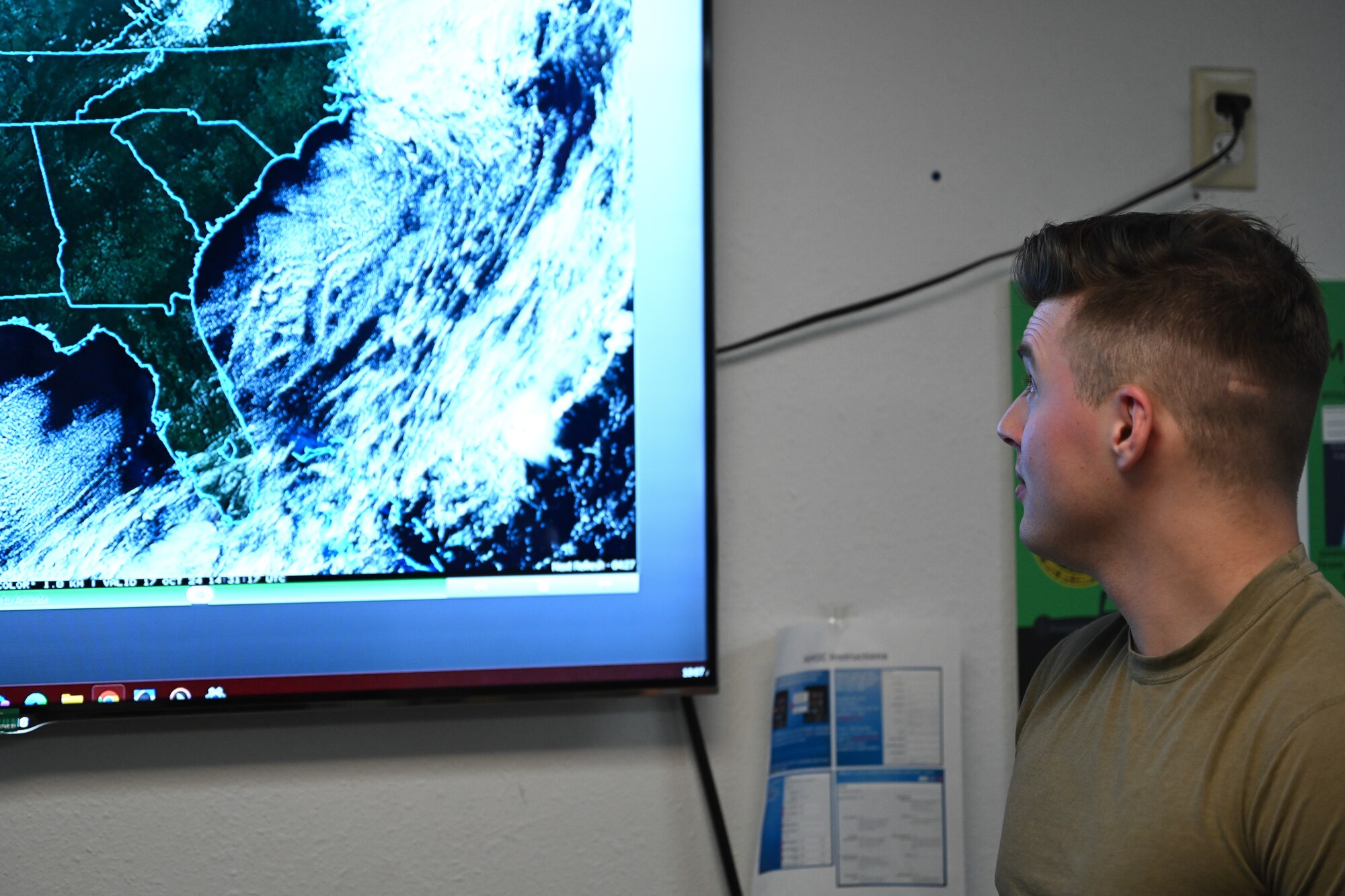 U.S. Air Force Senior Airman Jordan Reitmayer, 1st Special Operations Support Squadron weather forecaster, views upcoming weather at Hurlburt Field, Florida, Oct. 17, 2024.